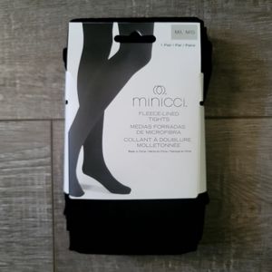 Black fleece lined polyester tights. New. Original packaging. Medium large size.